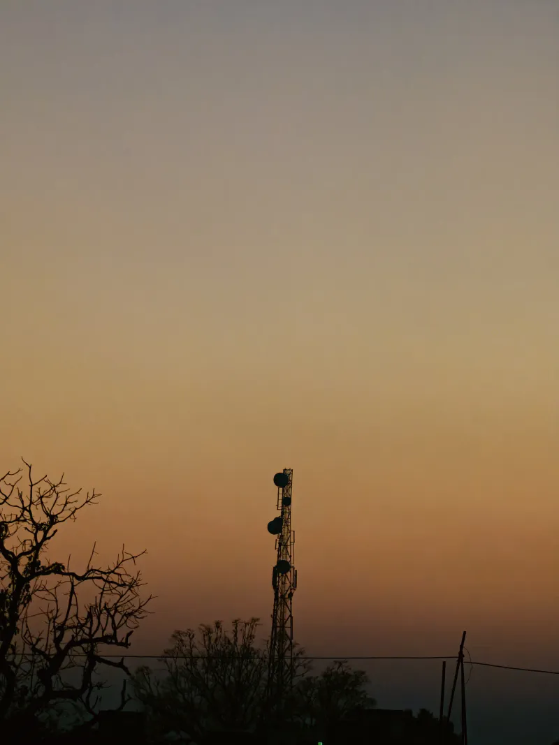 Silent signals reaching through the amber twilight glow.