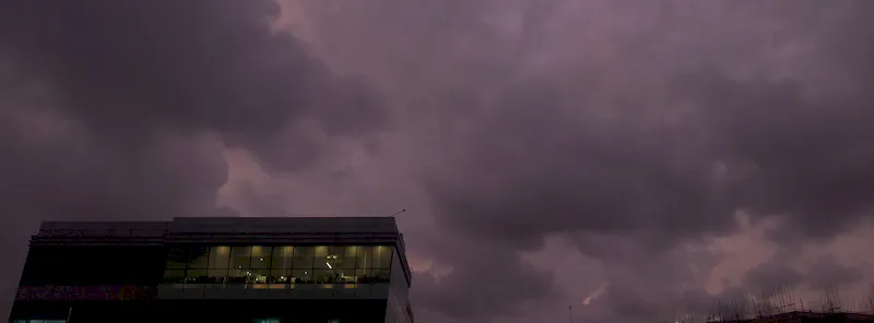 Whispers of gold beneath a bruised purple sky.